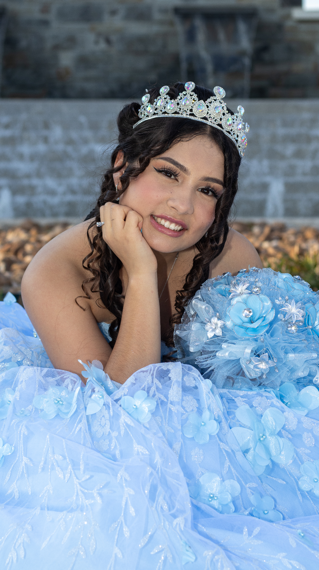 Quinceañera portrait with tiara and blue gown