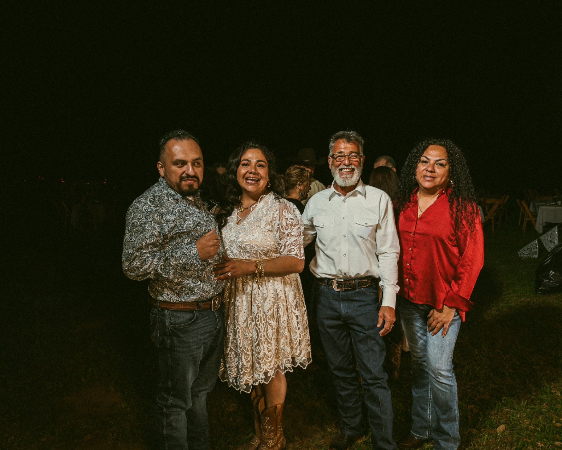 Family portrait at the wedding reception at night