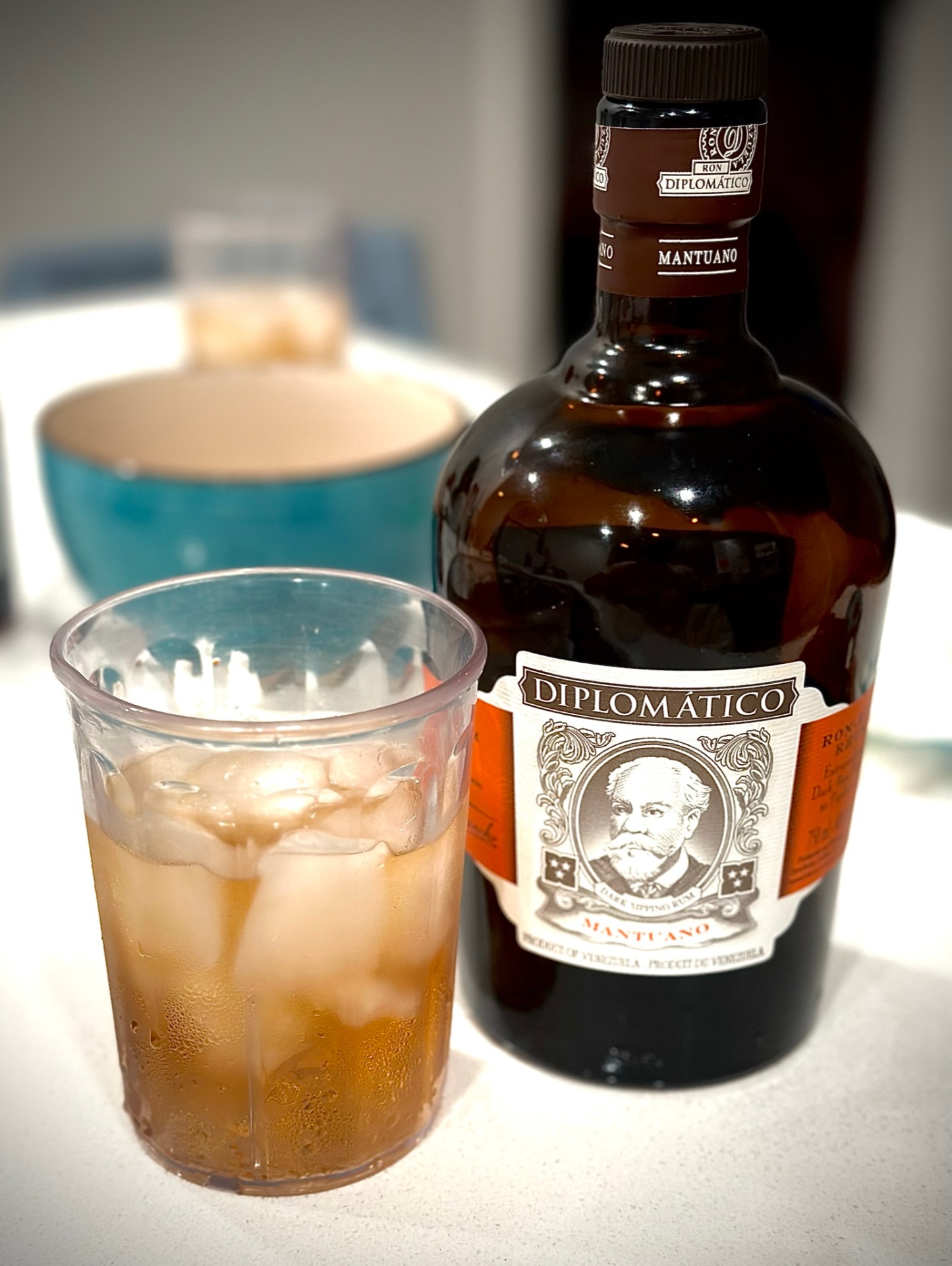 Diplomático rum bottle with a glass served over ice